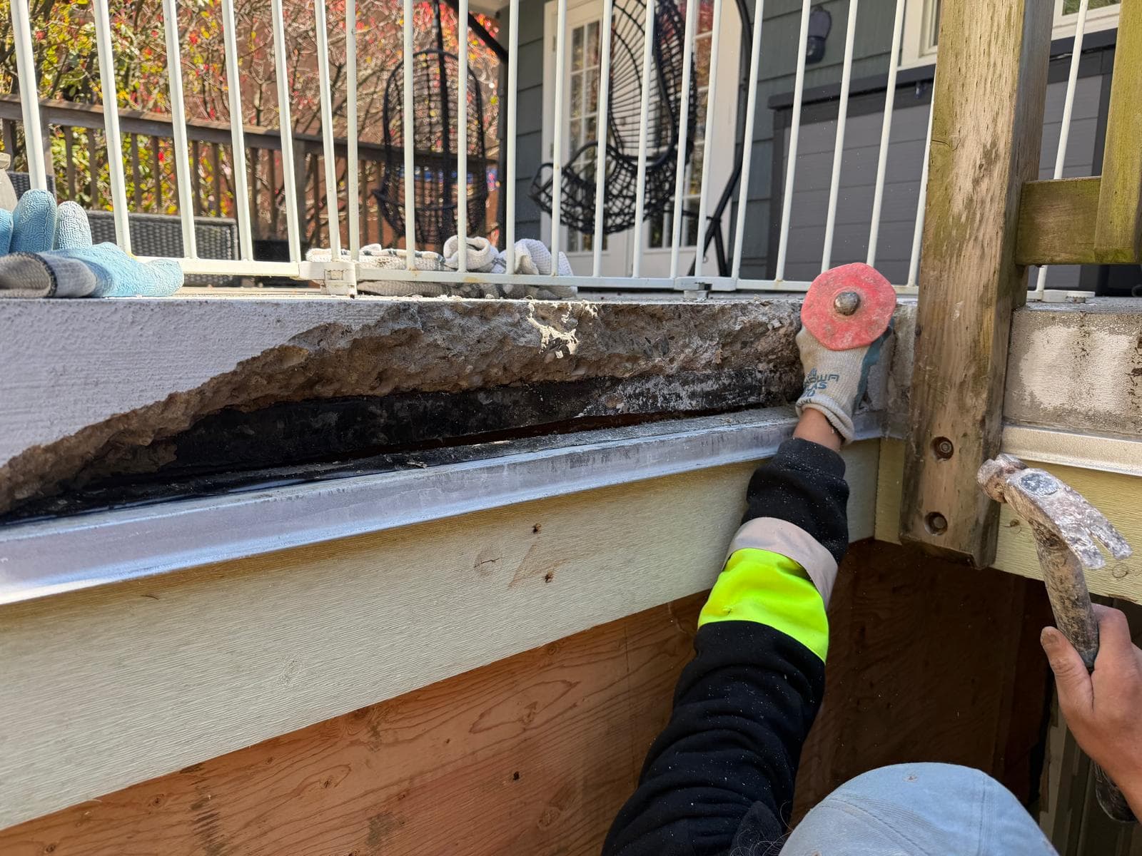 Failed deck membrane exposed — before